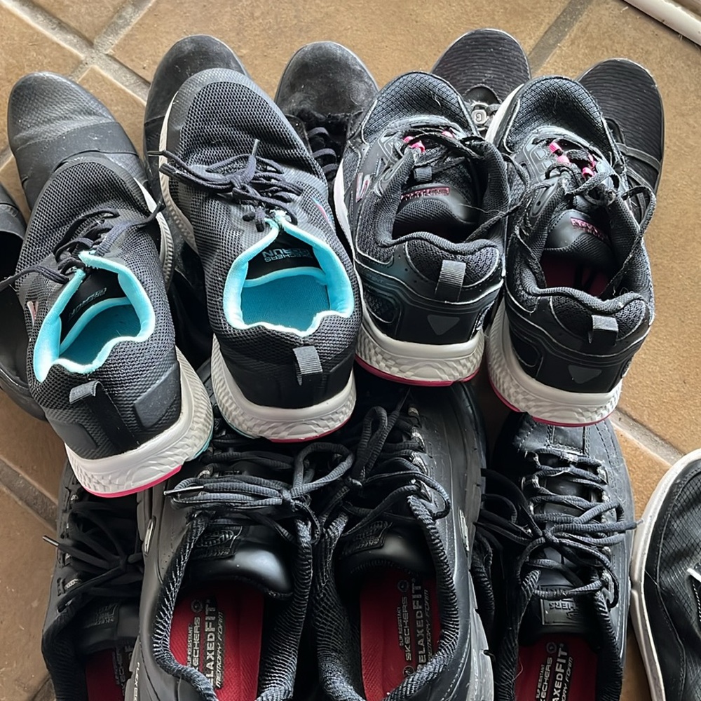 11 pairs of black assorted work and casual used but not abused women’s shoes